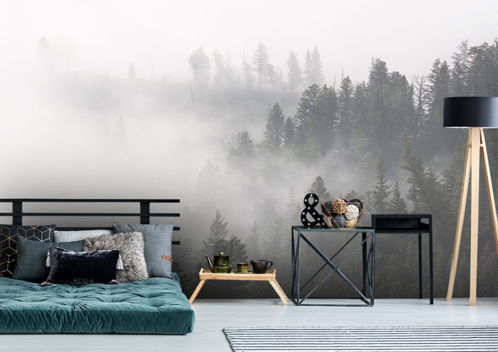 Foggy forest photo wallpaper with misty treetops. bedroom accent wall wallpaper set on one wall of a modern bedroom