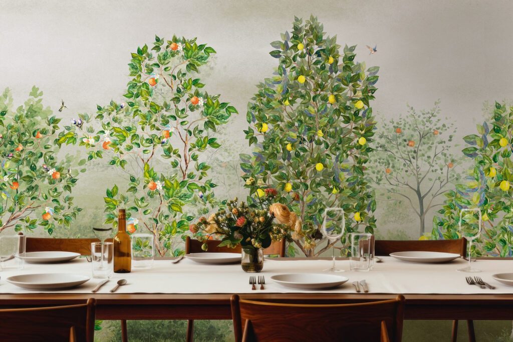 Mural wallpaper with painted lemon and orange trees on a green background in a dining room