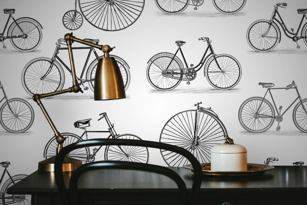 Designer wallpaper with bicycles. Black and white wallpaper in vintage style, adorning home office feature wall