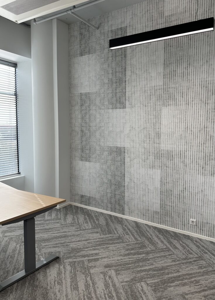 Commercial space grey, stripey wallpaper at an office wall