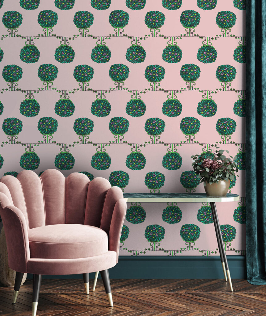 Oh so cute pink wallpaper for the boudoir corner! Pastel pink-colored wallpaper featuring a repeating pattern of stylized round trees with green foliage adorned with small colorful dots.