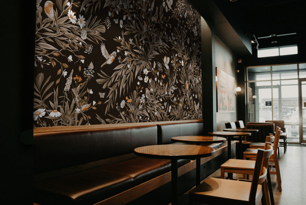 Black wallpaper mural set on a restaurant wall. Palyful Robins, Baubauwall Wallpapers, custom printed