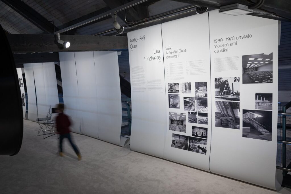 Wallpaper printing for the exhibition “8 Women. 4 Dialogues on Space” Baubauwall contributed to the production of wallpaper rolls for the exhibition “8 Women. 4 Dialogues on Space” at the Estonian Museum of Architecture. The exhibition installation consists of 50 wallpaper panels that flow from the ceiling onto a white carpeted floor, creating a spatial, immersive environment visitors experience in socks. The wallpaper surfaces play a central role in shaping the atmosphere and movement within the exhibition